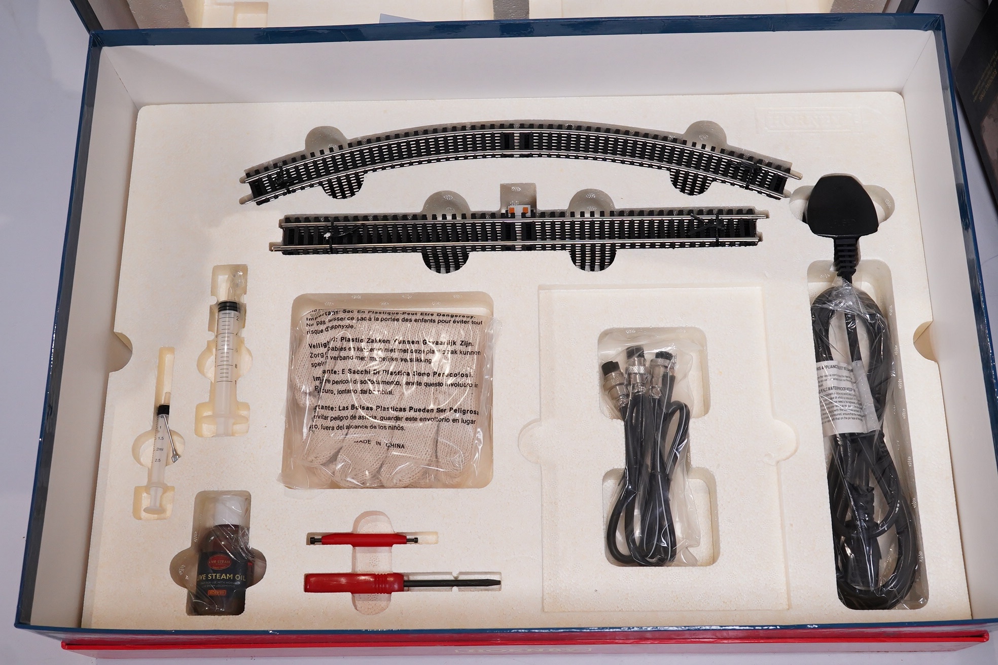 A boxed Hornby Hobbies 00 gauge railway live steam train set, comprising of an LNER Class A4 locomotive, Mallard, a quantity of track sections, controllers, and other accessories. Condition - good, appears unused with in